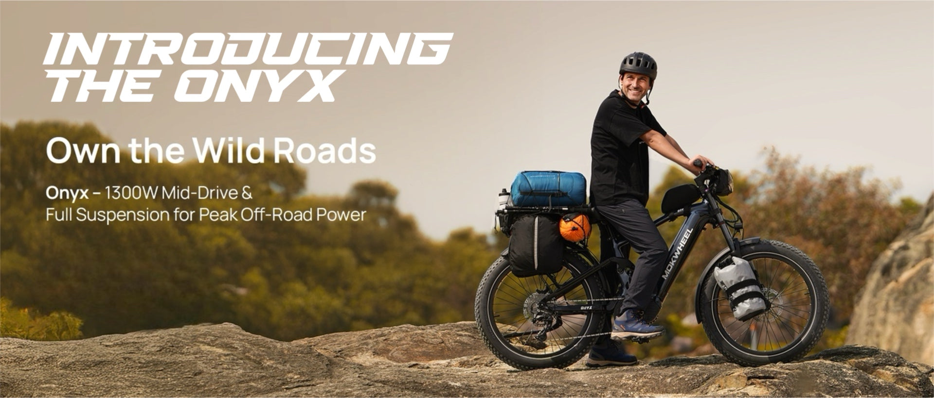 Man enjoying an Onyx e-bike ride over rugged terrain